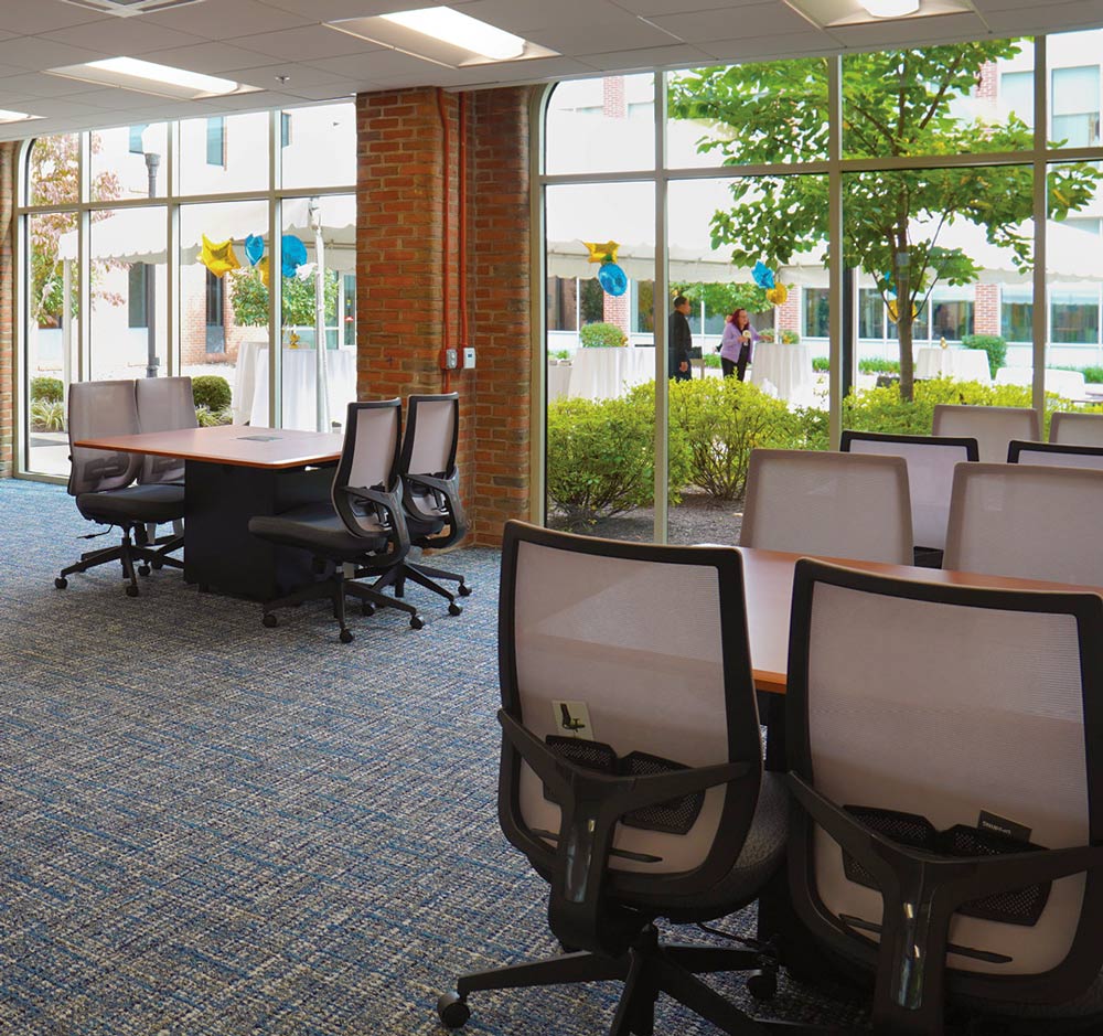 Stark Learning Center with tables, chairs and large floor to ceiling windows