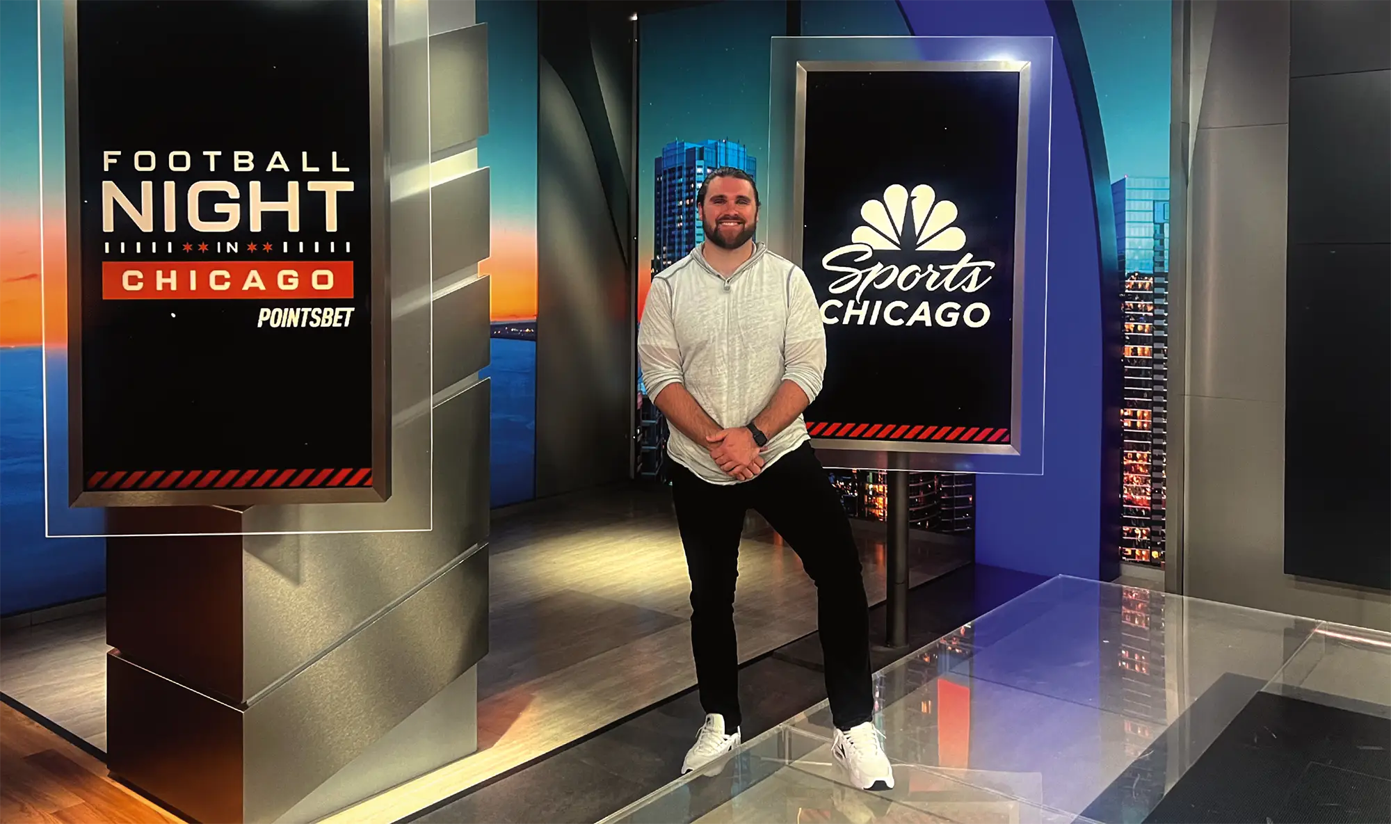 Anthony Dorunda posing in studio of NBC Sports Chicago