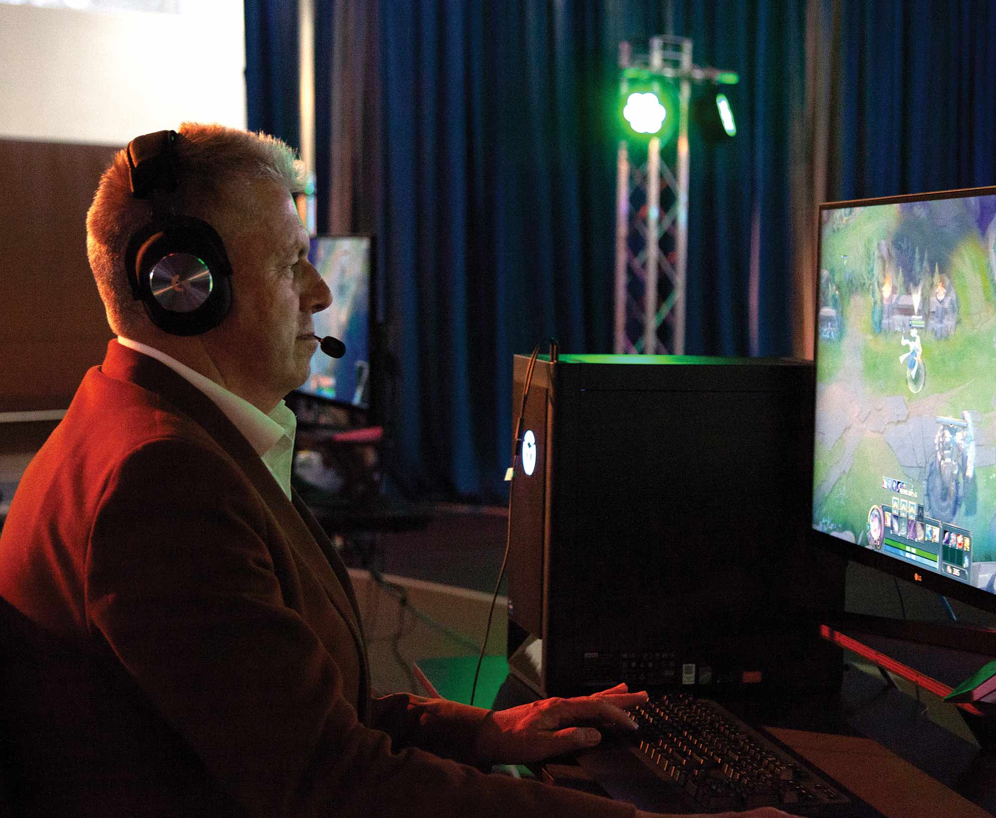 President Greg Cant using gaming equipment