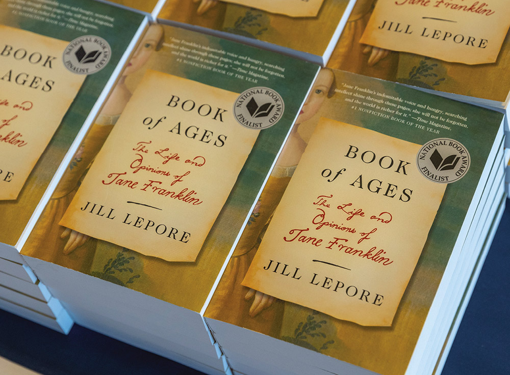 Stacks of Lepore's book "Book of Ages" on table