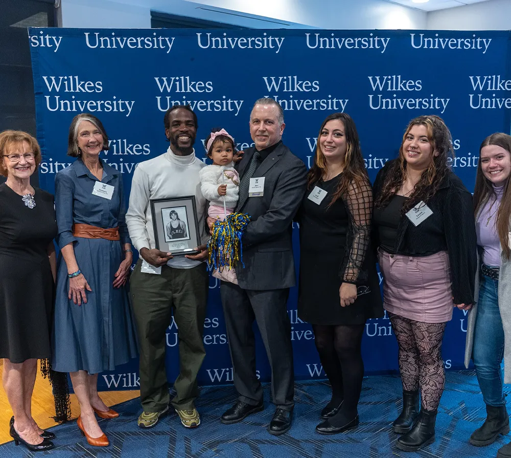 Group of people at a Wilkes University event, celebrating an award.
