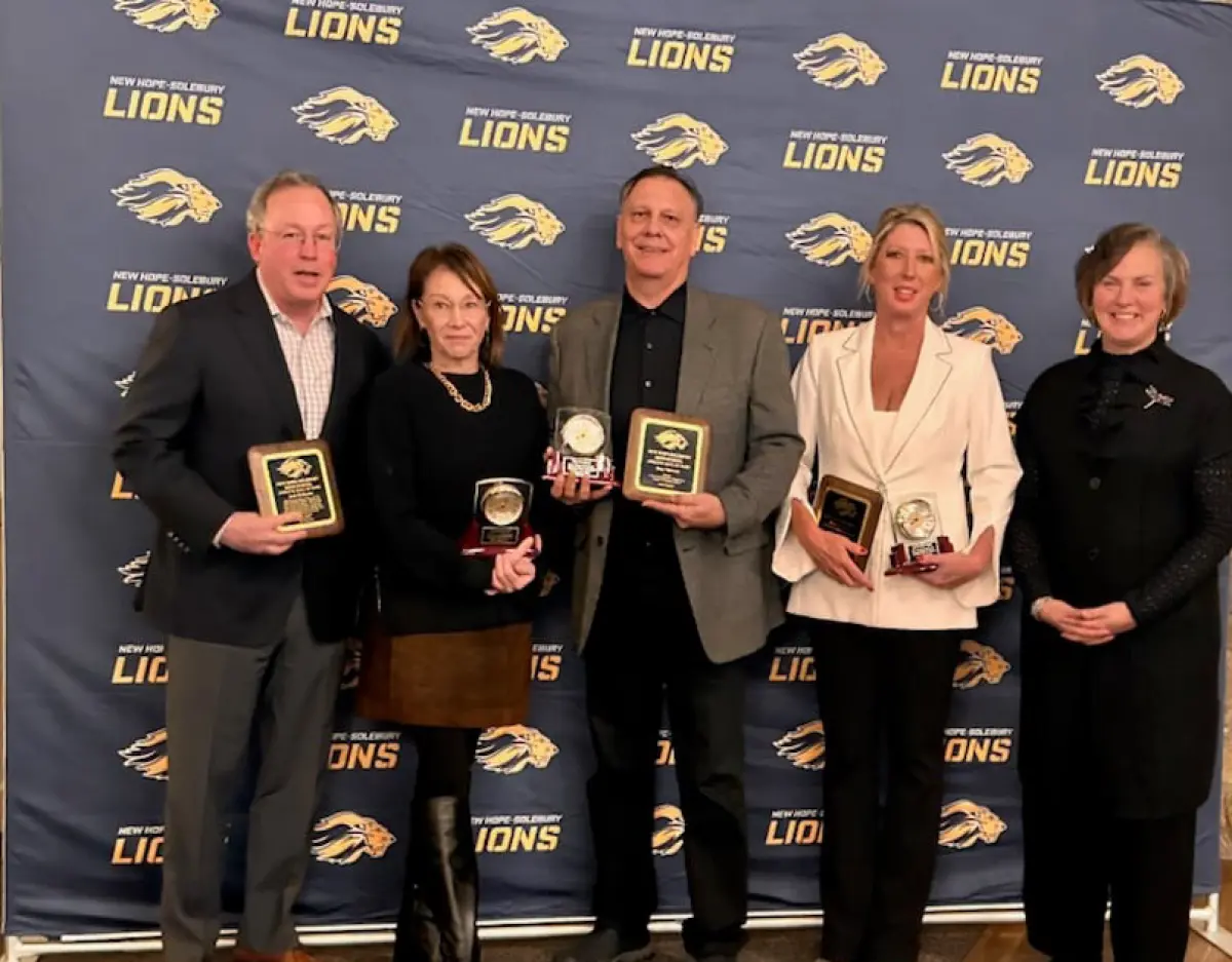Landscape orientation photograph of Tony Vlahovic being inducted into the New Hope-Solebury Sports Hall of Fame on Jan. 23, 2025; He is the winningest coach in the history of the school and is humbled by the honor; It is Vlahovic’s 17th year as the head coach; Here in this particular picture, Tony is seen receiving an award plaque alongside fellow other peers