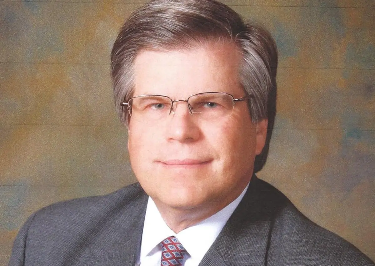 Headshot photograph of Attorney John A. Bednarz Jr. grinnning
